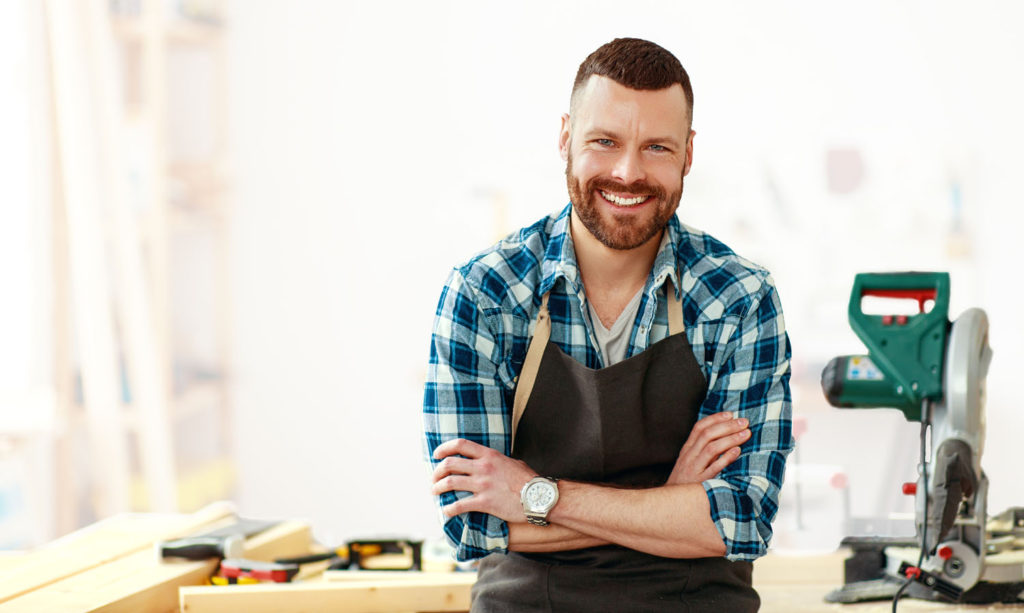 Proud craftman in his workshop